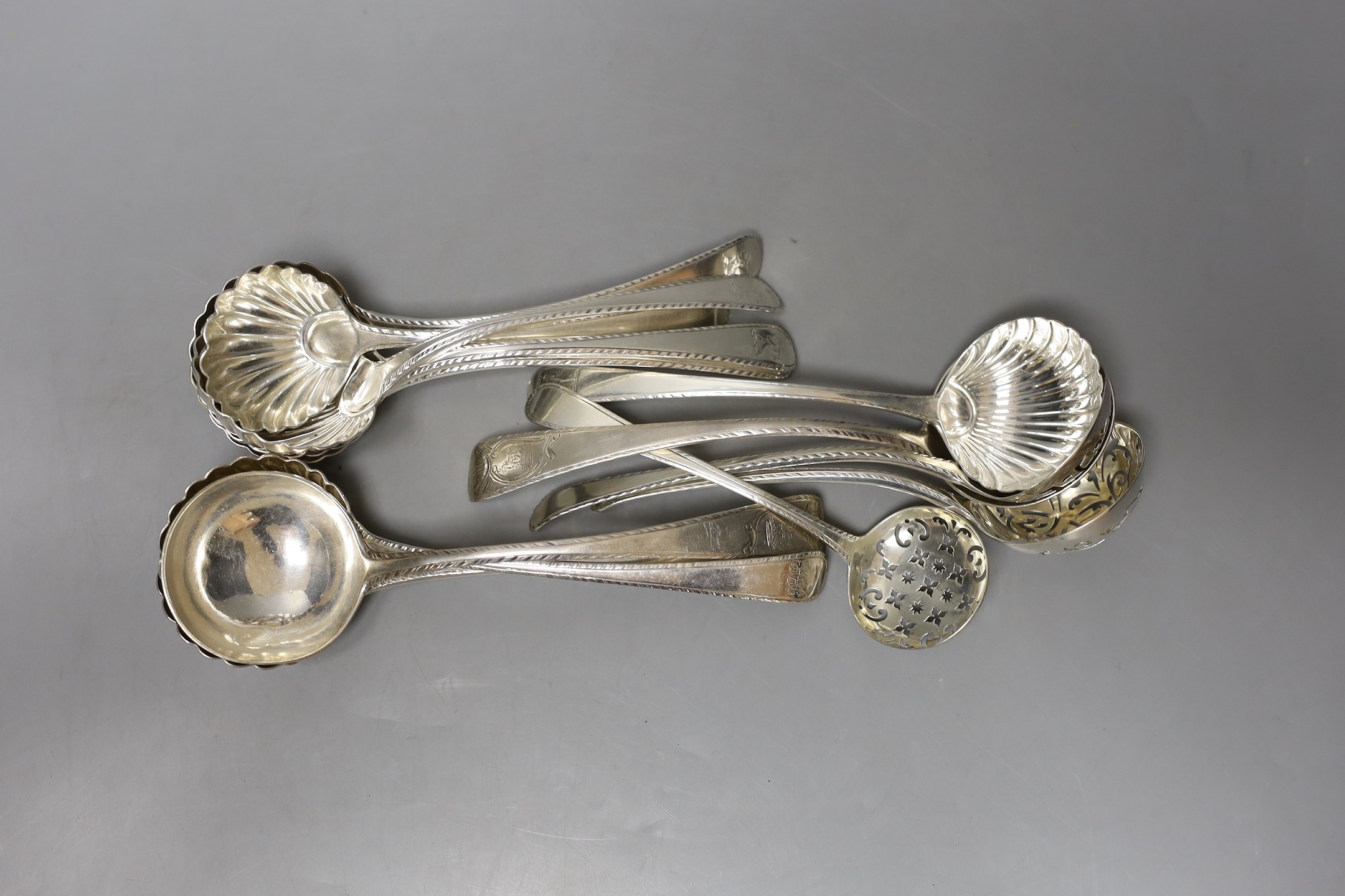 A set of four George III silver Old English pattern feather edge sauce ladles, London, 1771, 17.6cm, six other similar sauce ladles including two pairs and three Georgian silver sifter spoons